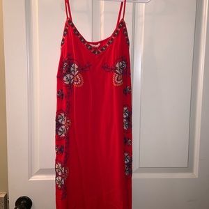 Francesca’s red embroidered dress